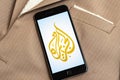 Black phone with logo of news media Al Jazeera on the screen. Royalty Free Stock Photo