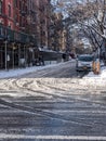 New York, USA - December 12: East Village street in Manhattan covered with pile of snow. Empty winter road with melting snow Royalty Free Stock Photo