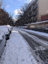 New York, USA - December 12: East Village street in Manhattan covered with pile of snow. Empty winter road with melting snow Royalty Free Stock Photo