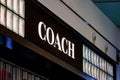 A logo of Coach brand on a side of a store in the mall of New York International Airport Royalty Free Stock Photo