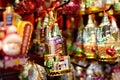 New York, USA - December 25, 2019: Lot colorful and multicolor christmas tree toys on Xmas market in New York. Rich selection