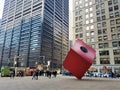Art object Red Cube by Isamu Noguchi 1968 with people walking by. Downtown of NYC Financinal District. Royalty Free Stock Photo