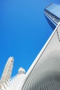 Looking up at World Trade Center complex with Oculus ribs WTC Transportation Hub against the blue sky.