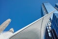 Looking up at World Trade Center complex with Oculus ribs WTC Transportation Hub against the blue sky.