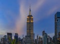 Manhattan downtown skyline with illuminated Empire State Building and skyscrapers at sunset, New York, USA Royalty Free Stock Photo