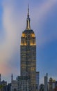 Manhattan downtown skyline with illuminated Empire State Building and skyscrapers at sunset, New York, USA Royalty Free Stock Photo