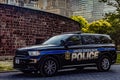 New York, USA June 1, 2023: Beautiful photograph of an official NYPD patrol car, with the Big Apple skyline and Manhattan. Royalty Free Stock Photo