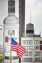 Flag of the United States of America with Ketel One Vodka banner and water tank in background in downtown Manhattan.