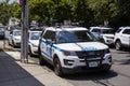 NYPD vehicles parked by a street on Staten Island.