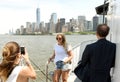 New York, USA - June 09, 2018: Passengers of the Statue of Liberty Ferry and buildings of financial district in lower Manhattan Royalty Free Stock Photo