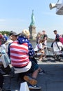 New York, USA - June 09, 2018: Passengers of the Statue of Liberty Ferry and buildings of financial district in lower Manhattan Royalty Free Stock Photo