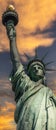 New York, USA June 1, 2023: The Statue of Liberty holding its torch under a stunning Big Apple sunrise. Royalty Free Stock Photo