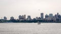 New York, USA - June 7, 2019: Tourist boats on East River in front of Manhattan, A East River ferry boat travels the Hudson River