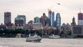New York, USA - June 7, 2019: Tourist boats on East River in front of Manhattan, A East River ferry boat travels the Hudson River