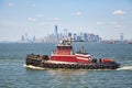 Towing vessel Eric McAllister with Manhattan skyline in distance.