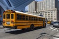 New York, USA June 1, 2023: The typical North American yellow school bus, driving around the Big Apple transporting school