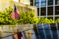 New York, USA June 1, 2023: U.S. flag at the World Trade Center memorial, honoring the victims of the terrorist attack. Royalty Free Stock Photo