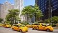 Yellow Taxi Cabs on Broadway Road on a sunny summer day.