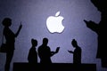 NEW YORK, USA, 25. MAY 2020: Apple American multinational technology company Group of business people chat on mobile phone and
