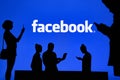 NEW YORK, USA, 25. MAY 2020: Facebook online social media and social networking Group of business people chat on mobile phone and