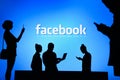 NEW YORK, USA, 25. MAY 2020: Facebook online social media and social networking Group of business people chat on mobile phone and