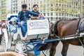 NEW YORK, USA - MAY 5, 2018: A horse and buggy carriage with coachman in Central Park in New York City. Royalty Free Stock Photo