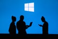 NEW YORK, USA, 25. MAY 2020: Microsoft Windows graphical operating system Group of business people chat on mobile phone and laptop