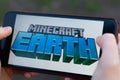 New York, USA - 1 May 2020: Minecraft Earth app logo close-up on phone screen, Illustrative Editorial