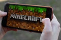 New York, USA - 1 May 2020: Minecraft game app logo close-up on phone screen, Illustrative Editorial