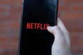 New York, USA - 1 May 2020: Netflix app logo close-up on phone screen, Illustrative Editorial