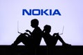 NEW YORK, USA, 25. MAY 2020: Nokia a Finnish telecommunications, technology, and electronics company Children silhouette, sitting