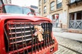 Plush mascot fastened to a truck bumper parked on a street in Brooklyn Dumbo.