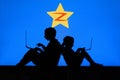 NEW YORK, USA, 25. MAY 2020: QZone social networking website based in China vChildren silhouette, sitting together and playing on