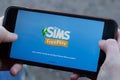 New York, USA - 1 May 2020: The Sims Free Play mobile game app logo close-up on phone screen, Illustrative Editorial