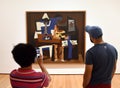 New York, USA - May 25, 2018: A visitors near the Pablo Picasso Three Musicians painting in Museum of Modern Art in New York City