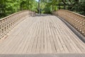 New York, USA- May 21, 2014. Young couple walking over the bridge in Central park in New York City. Royalty Free Stock Photo