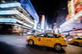 NYC Yellow Cab passing Fast at Night in Timesquare Manhattan, Ne