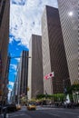 NEW YORK, USA - September 22, 2018 - Midtown Manhattan street view with taxi cabs and American and Japanese flags