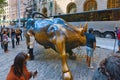 Monument of Charging Bull Financial on Broadway, near Wall Street in the New York with people and tourists. Royalty Free Stock Photo
