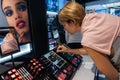 Woman testing makeup in Macys store