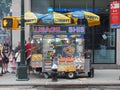 New York, USA. Street food. Fast food cart selling hot dogs and other snack or food in New York City. Food trucks along the town