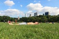 A young guy sunbathing on the grass at the Central Park. Travel around America. Royalty Free Stock Photo