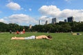 A young guy sunbathing on the grass at the Central Park. Travel around America. Royalty Free Stock Photo