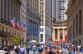 New York, Wall Street stock exchange with classic columns and old architecture and colorful flags of united states of Royalty Free Stock Photo