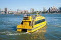 NEW YORK - Water Taxi with Brooklyn bridge Royalty Free Stock Photo