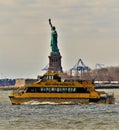 New York Water taxi with the statue of liberty Royalty Free Stock Photo