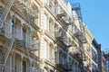 New York white buildings facades with fire escape stairs Royalty Free Stock Photo