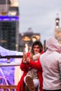 New York, New York - 12/24/2018 : Woman taking a selfie on top of a rooftop pop up igloo bar in Manhattan.