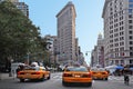 New York yellow taxi cabs rush through Fifth Avenue in Manhattan
