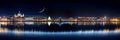 New York city at night panoramic cityscape , blurred neon light reflection,sea water , starry sky and moon